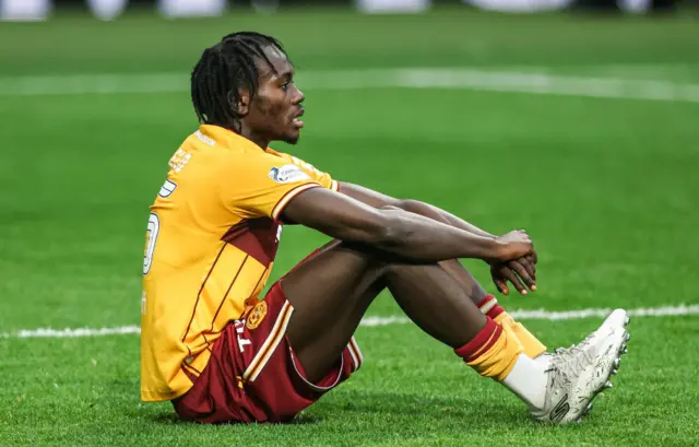 Motherwell defender Emmanuel Longelo looks dejected at full time