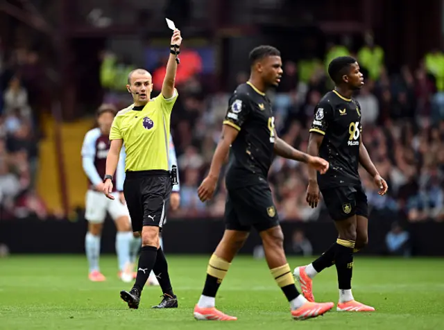 Lyle Foster of Burnley is shown a yellow card