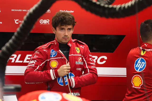 Charles Leclerc gets ready in teh Ferrari garage