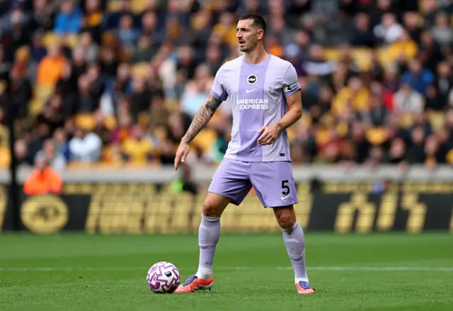 Lewis Dunk of Brighton & Hove Albion controls the ball