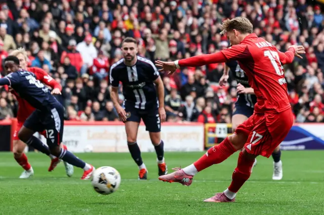 Jesper Karlsson scores from the penalty spot