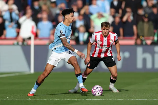 Nico O'Reilly of Manchester City controls the ball whilst under pressure from Yehor Yarmoliuk
