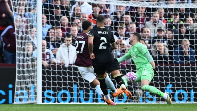 Burnley goalkeeper Martin Dubravka (right) saves