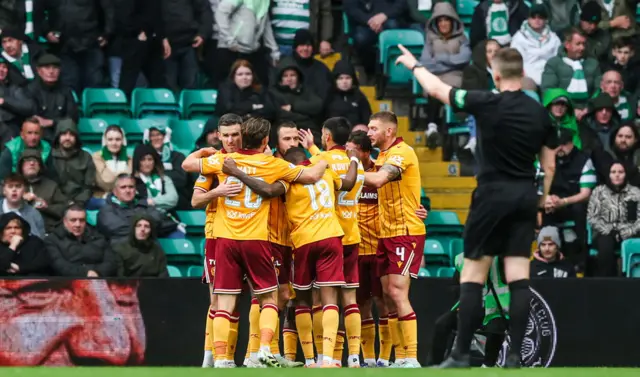 Motherwell players celebrate at Celtic Park