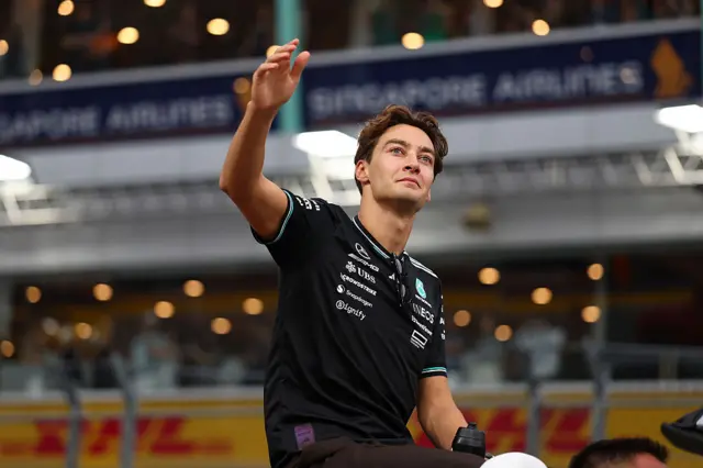 George Russell waves to the Singapore crowd