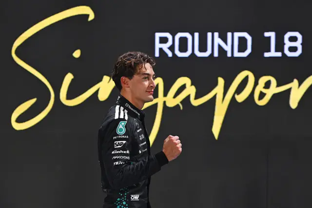 George Russell celebrates taking pole in Singapore