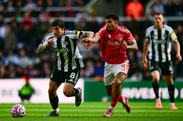 Sandro Tonali of Newcastle United FC (8) and Morgan Gibbs-White of Nottingham Forest (10) chase the ball