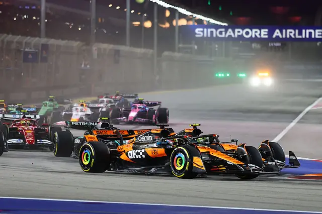 Lando Norris and Oscar Piastri fight for position at the Singapore race start