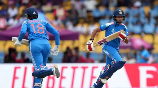 Pratika Rawal of India (R) runs between the wickets with team mate Smriti Mandhana of India