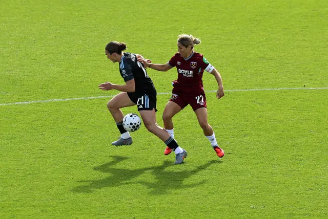 Lucia Kendall of Aston Villa is challenged by Katrina Gorry of West Ham United during the Barclays Women's Super League match between West Ham United and Aston Villa at Chigwell Construction Stadium on October 05, 2025 in Dagenham, England.