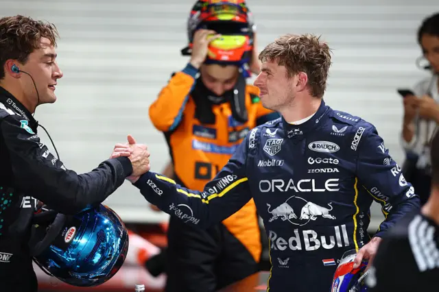 George Russell and Max Verstappen shake hands after qualifying