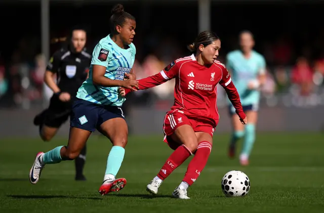 Fuka Nagano of Liverpool is put under pressure by Nikita Parris of London City Lionesses during the Barclays Women's Super League match between London City Lionesses and Liverpool at Copperjax Community Stadium on October 05, 2025 in Bromley, England.