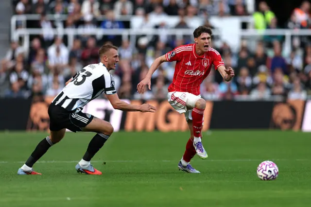 Nicolo Savona of Nottingham Forest is put under pressure by Dan Burn