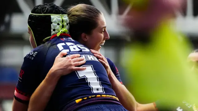 Phoebe Hook of St Helens celebrating her try with Beri Salihi of St Helens