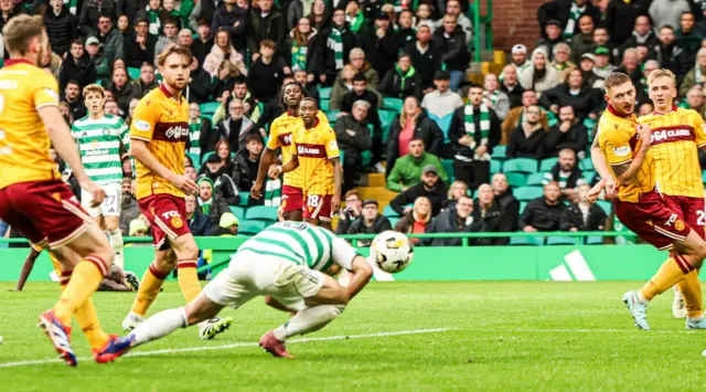 Daizen Maeda stoops to head in the winning goal at Celtic Park