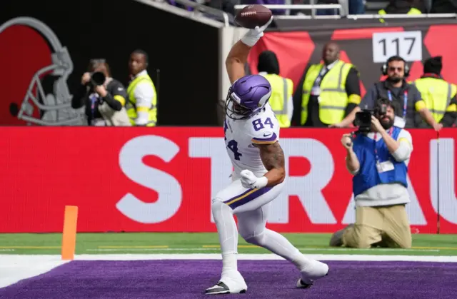 Josh Oliver spikes the ball after a touchdown for the Minnesota Vikings at Tottenham