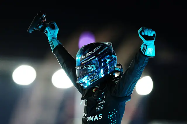 George Russell celebrating after winning in Singapore