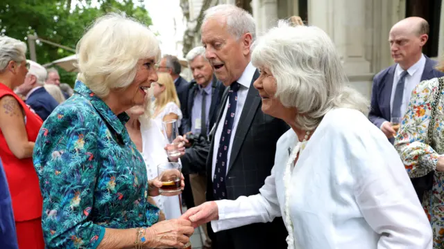 Queen Camilla meeting Jilly Cooper at a party