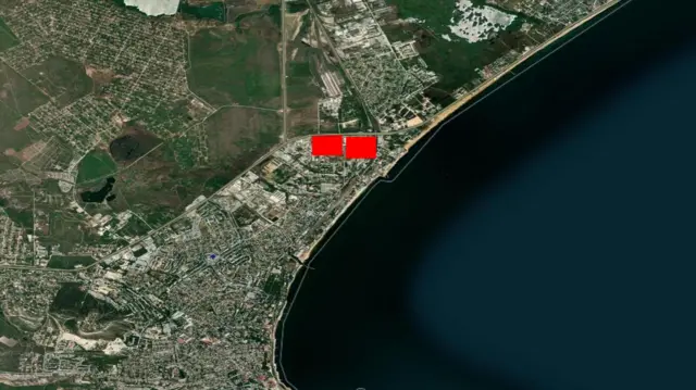 Satellite image of the oil depot with two red boxes indicating heat signatures