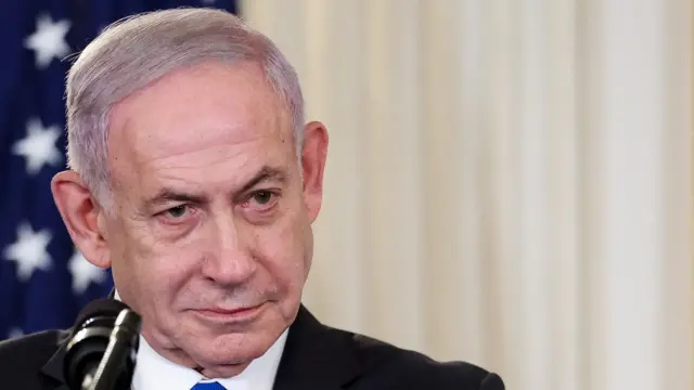 Benjamin Netanyahu attends a press conference