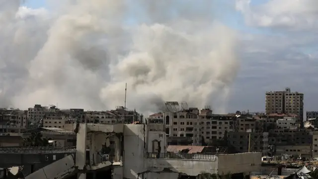 Smoke rises following Israeli air strikes at Tal Al Hawa neighbourhood during an Israeli military operation in Gaza City,