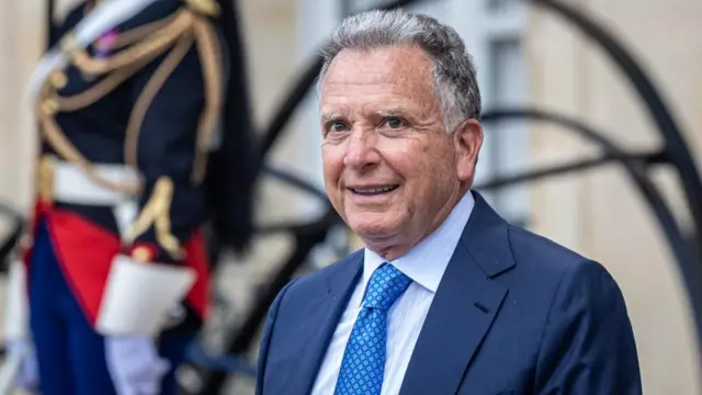 Steve Witkoff standing outside, dressed in a suit, smiling