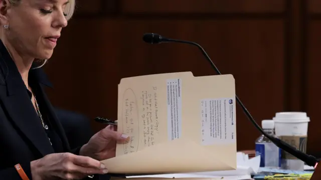 U.S. Attorney General Pam Bondi holds a file as she testifies before a Senate Judiciary Committee oversight hearing on Capitol Hill in Washington, D.C