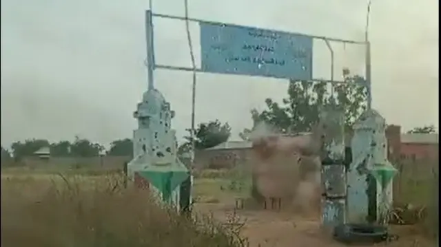 A screengrab from a video we've verified showing the gates of the Sudanese army air defence base