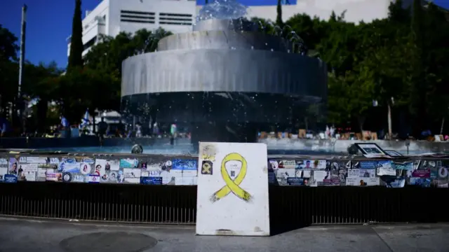 fountain adorned with memorabilia and stickers related to hostages, fallen soldiers and victims of the deadly October 7, 2023 attack on Israel by Hamas from Gaza, on the two-year anniversary of the attack, in Tel Aviv