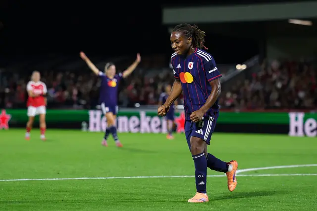 Melchie Dumornay of OL Lyonnes celebrates scoring her team's first goal during the UEFA Women's Champions League 2025/26 league phase match between Arsenal FC and OL Lyonnesat Meadow Park on October 07, 2025 in Borehamwood, England.