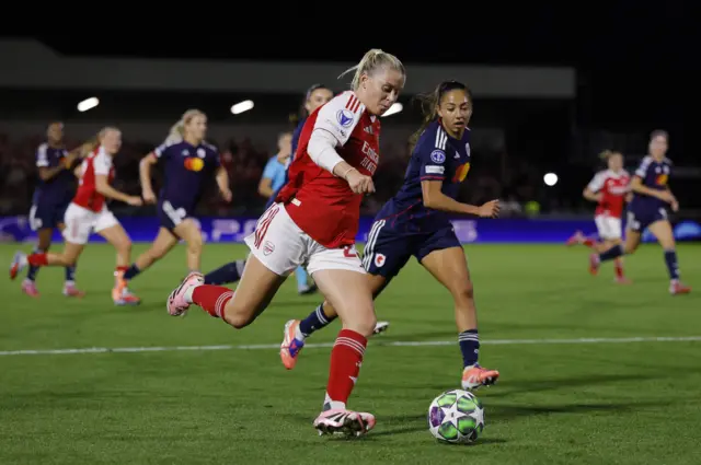 Arsenal's Alessia Russo in action with Olympique Lyonnais' Ingrid Syrstad Engen