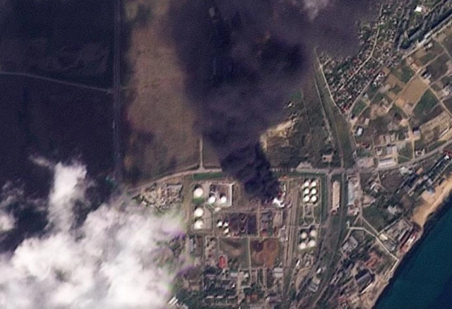 A thick cloud of black smoke as seen by satellite coming from the Feodosia oil depot in Russian-occupied Crimea