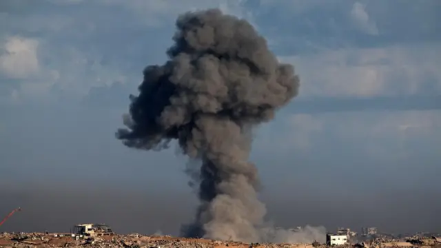 Smoke rises as a result of an Israeli strike on the outskirts of Gaza City as seen from the Israeli side of the border,