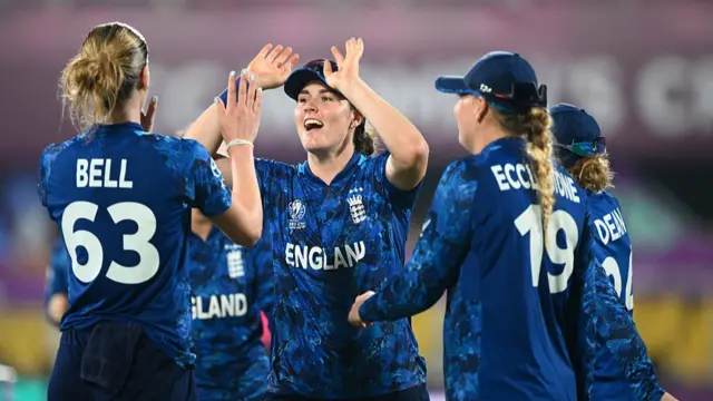 Lauren Bell of England is congratulated by team mate Nat Sciver-Brunt