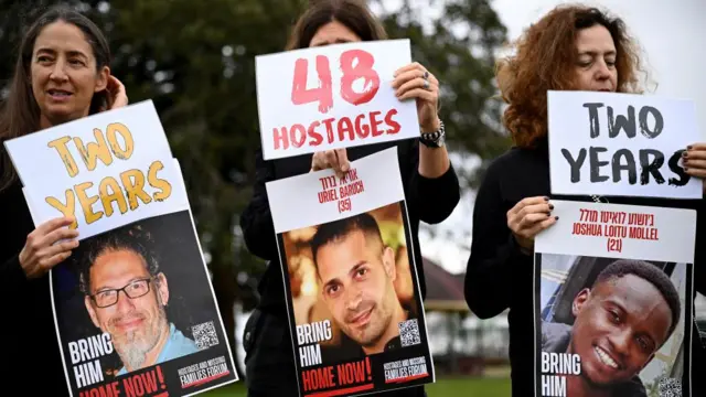 Protestors hold placards featuring pictures of Israeli hostages during a press conference marking the two-year anniversary of the Hamas attack against Israel, in Sydney, Australia, 7 October 2025.