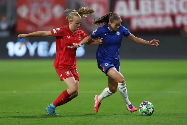 Guro Reiten of Chelsea controls the ball under pressure from Leonie Vliek of FC Twente during the UEFA Women's Champions League 2025/26 league phase match between FC Twente and Chelsea FC Women at De Grolsch Veste on October 08, 2025 in Hengelo, Netherlands.