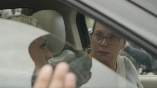 Woman looking out of a car window