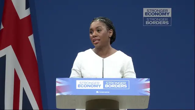Kemi Badenoch wearing white dress