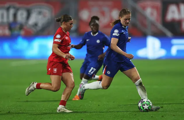 Sjoeke Nuesken of Chelsea controls the ball under pressure from Lynn Groenewegen of FC Twente during the UEFA Women's Champions League 2025/26 league phase match between FC Twente and Chelsea FC Women at De Grolsch Veste