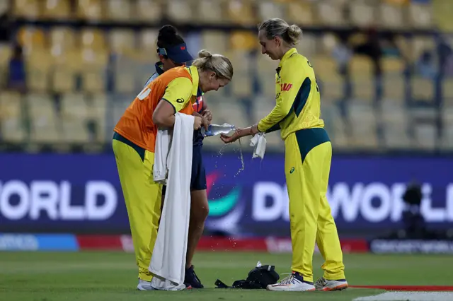 Ash Gardner getting her hand cleaned up