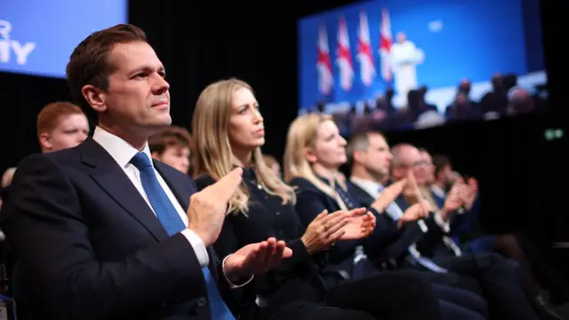 British Shadow Secretary of State for Justice Robert Jenrick (L) and British Shadow Secretary of State for Education Laura Trott (R) applaud during the speech by the party leader Kemi Badenoch on the final day of the Conservative Party Conference in Manchester, Britain, 08 October 2025.