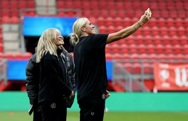 Millie Bright of Chelsea takes a selfie with teammates prior to the UEFA Women's Champions League 2025/26 league phase match between FC Twente and Chelsea FC Women at De Grolsch Veste on October 08, 2025 in Hengelo, Netherlands.