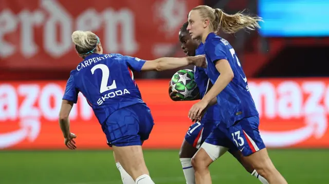 Sandy Baltimore of Chelsea (obscured) celebrates scoring her sides first goal during the UEFA Women's Champions League 2025/26 league phase match between FC Twente and Chelsea FC Women at De Grolsch Veste