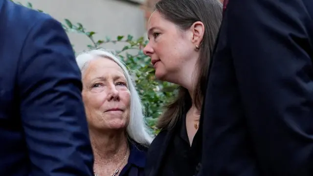 Failor and Maureen Comey wait in line outside the courthouse
