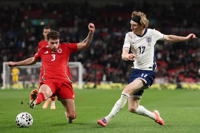 Anthony Gordon of England passes the ball as Neco Williams