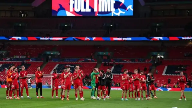 Wales players acknowledge the fans