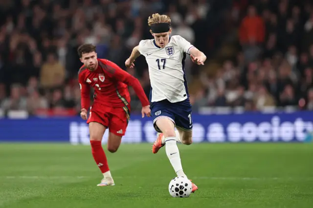 Anthony Gordon of England runs with the ball