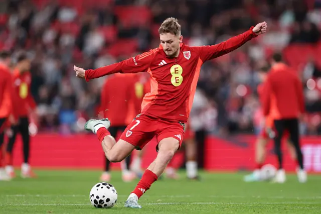 David Brooks of Wales warms up