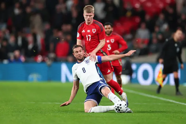 Jordan Henderson of England in action with Jordan James