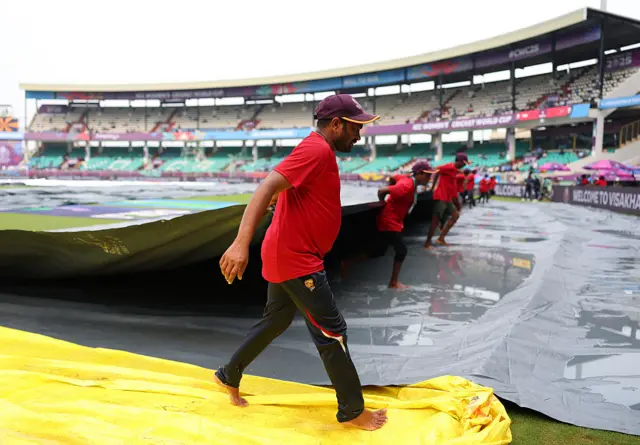 Groundsmen checking the pitch